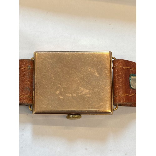 154 - A mid 20th century 9ct gold wristwatch, the silvered rectangular dial with Roman numerals and subsid... 