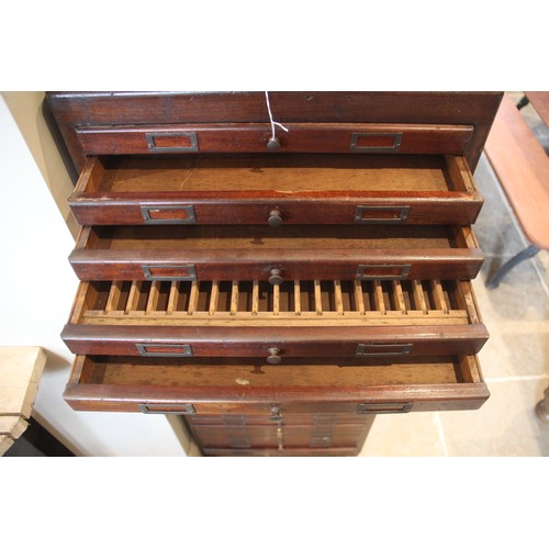 815 - An elm collectors/specimen cabinet, early 20th century, the figured elm side panels enclosing twenty... 