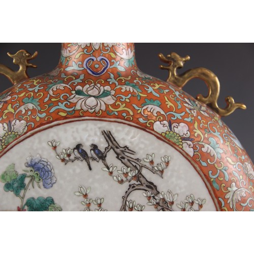 437 - A large pair of Chinese porcelain moon flasks, 19th century (Xianfeng / Tongzhi), each centrally dec... 