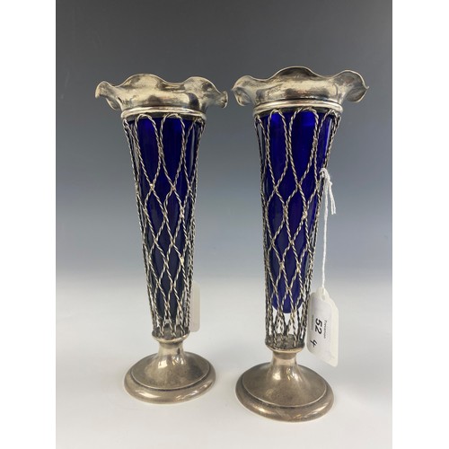 52 - A pair of Edwardian silver posy vases, Thomas Bradbury and Sons Ltd, Birmingham 1906, the flared rim... 