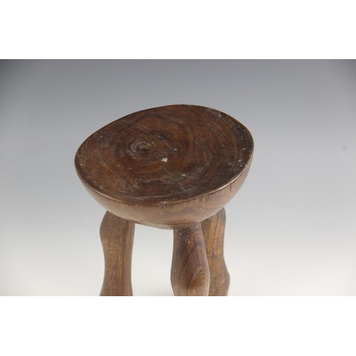 412 - An East African Karamojong tribal headrest, from Uganda, 19.5cm high, a Ugandan Hima milk pot, 24cm ... 