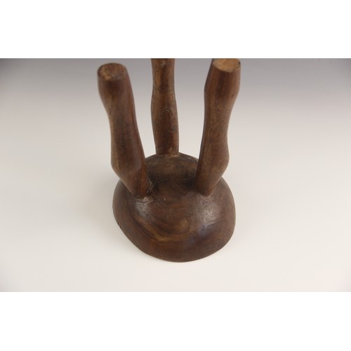 412 - An East African Karamojong tribal headrest, from Uganda, 19.5cm high, a Ugandan Hima milk pot, 24cm ... 