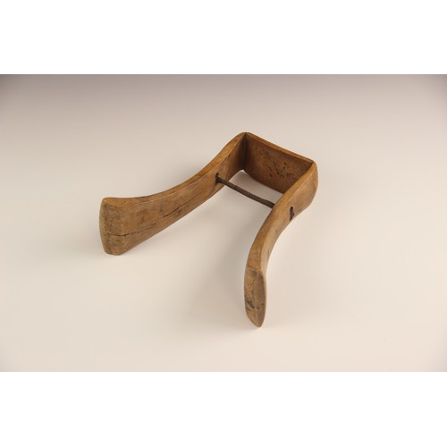 412 - An East African Karamojong tribal headrest, from Uganda, 19.5cm high, a Ugandan Hima milk pot, 24cm ... 