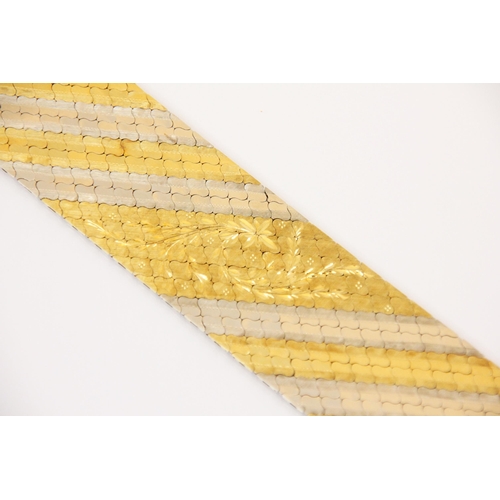 107 - A two tone yellow and white metal bracelet, the flat link bracelet with yellow and white metal strip... 