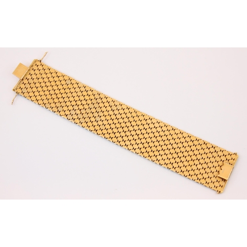 107 - A two tone yellow and white metal bracelet, the flat link bracelet with yellow and white metal strip... 