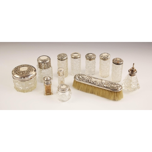 11 - A selection of silver mounted dressing table items, to include an Edwardian silver mounted jar, Fran... 