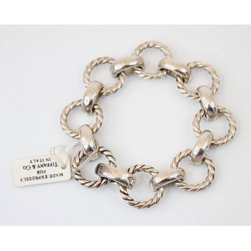 122 - A white metal Tiffany and Co bracelet, designed as alternating rope twist and plain polished links, ... 