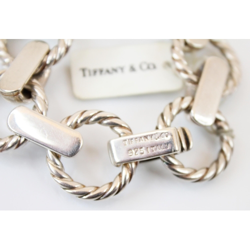 122 - A white metal Tiffany and Co bracelet, designed as alternating rope twist and plain polished links, ... 