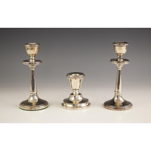 13 - A pair of George V silver candlesticks, possibly H J Cooper and Co Ltd, Birmingham 1919, of plain po... 