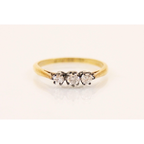 131 - An Edwardian style three stone diamond ring, the central round cut diamond with graduated round cut ... 