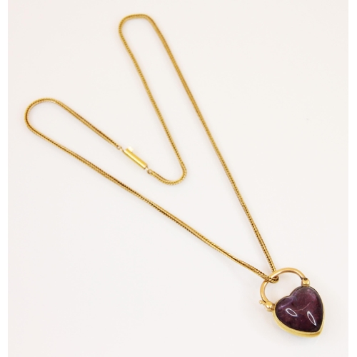 193 - An untested amethyst heart shaped locket/clasp, the cabochon heart amethyst in a yellow metal plain ... 