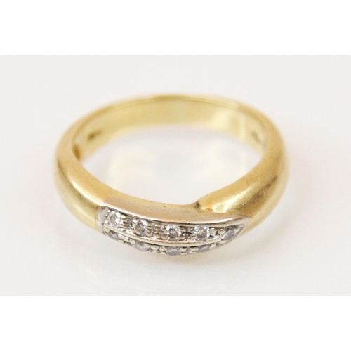 194 - A late 20th century diamond and yellow metal ring, the nine round cut diamonds set within a white me... 