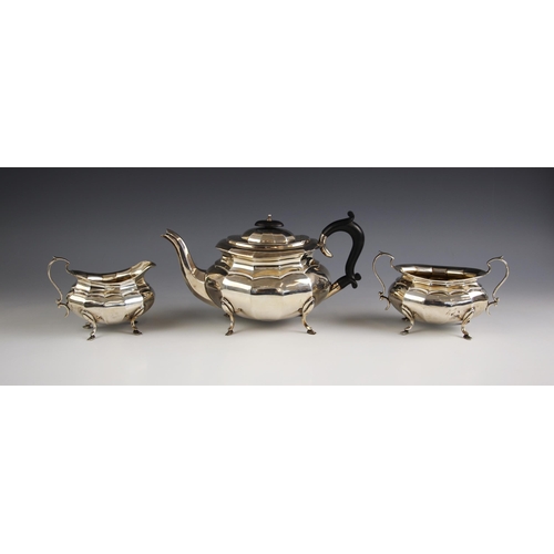 20 - A George V silver tea service, Charles S Green and Co Ltd, Birmingham 1923- 1924, the faceted body a... 