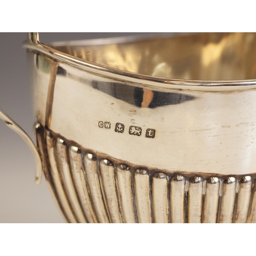 23 - An Edwardian silver milk jug, John Turton and Sons, Sheffield 1908, the grooved rim with conforming ... 