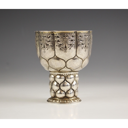 24 - An Edwardian silver chalice of small proportions, Carl Krall, London 1903, the scalloped rim above i... 