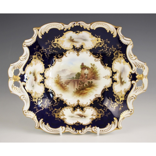 373 - A Coalport two handled porcelain bon bon dish, late 19th/early 20th century, enamelled with an archi... 