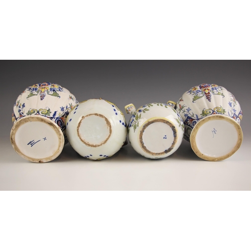 396 - A near pair of French faience jars and covers, 20th century, of lobed inverted baluster form, the co... 