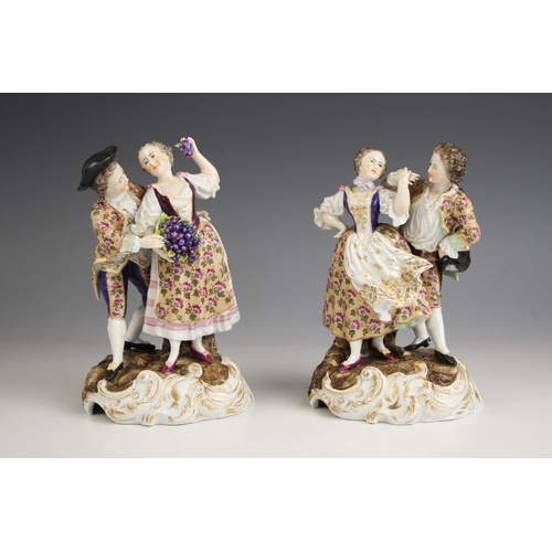 420 - A pair of porcelain egg cups in the manner of Meissen, 19th century, modelled as portly gentlemen ho... 