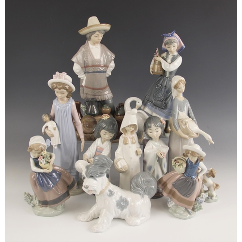 452 - Eleven Lladro figures, late 20th century, to include a male pot seller, 30cm high, a female pot sell... 