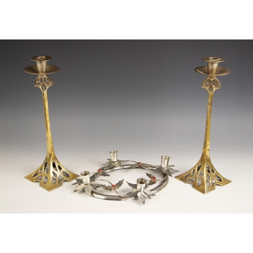 542 - A pair of silver plated brass Art Nouveau candlesticks, late 19th century/early 20th century, the pi... 