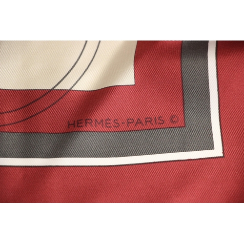 577 - An Hermes silk scarf, in the 'Ex Libris' pattern designed by Hugo Grygkar, in wine and grey, with ro... 