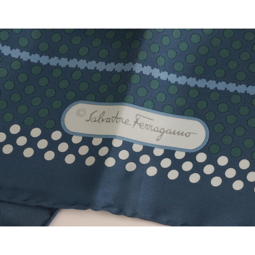 582 - A Salvatore Ferragamo silk scarf, decorated in geometric design with flowers, spots and logo in whit... 