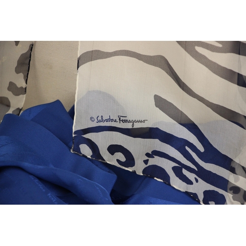 582 - A Salvatore Ferragamo silk scarf, decorated in geometric design with flowers, spots and logo in whit... 