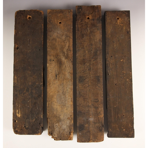 608 - Four 17th century carved walnut terms, to include an example carved with a bearded gentleman over a ... 