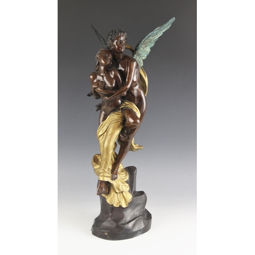 613 - A bronze sculpture of Cupid and Psyche, 20th century, modelled arms embraced upon a naturalistic roc... 