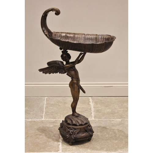 614 - A bronze floor standing jardinere stand, 20th century, modelled as Cupid arms aloft holding a boat s... 