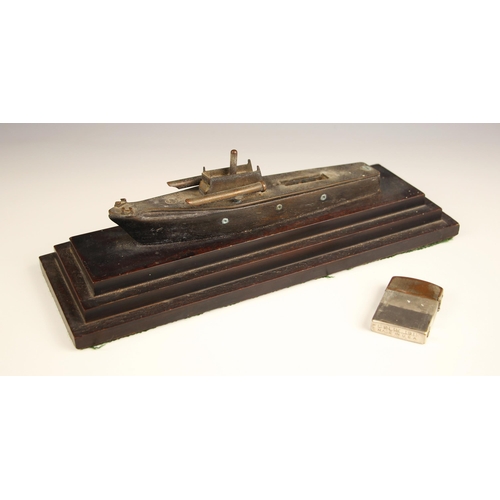 639 - A table lighter modelled as a torpedo boat, 20th century, the wooden hull with metal fittings holdin... 