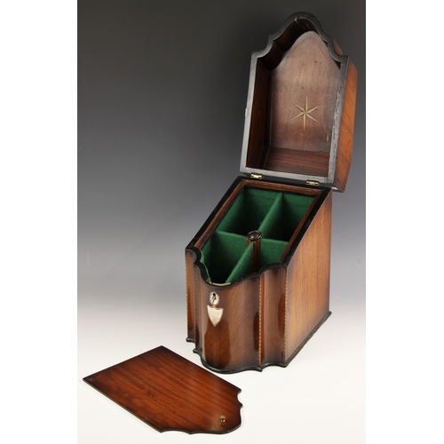 679 - A George III mahogany and rosewood crossbanded cutlery box, of serpentine form, the hinged top centr... 