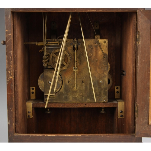 697 - A German walnut cased bracket clock, early 20th century, the architectural case with fluted pillars ... 