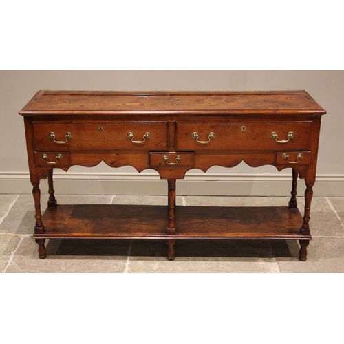 731 - A George III style figured elm pot board dresser, 20th century, the high back with a moulded cornice... 