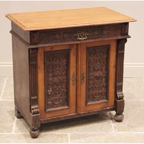 755 - A Victorian pitch pine ecclesiastical side cabinet, late 19th century, the rectangular moulded top a... 