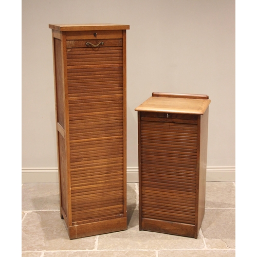 795 - A honey oak tambour front filing cabinet, mid 20th century, the rectangular top with a rear gallery ... 