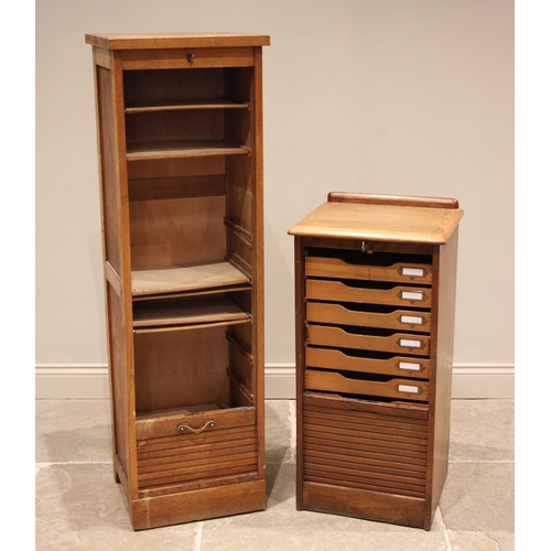 795 - A honey oak tambour front filing cabinet, mid 20th century, the rectangular top with a rear gallery ... 