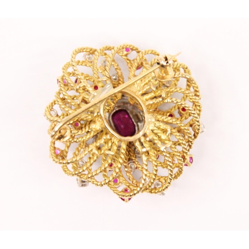 105 - A pair of ruby and diamond lapel brooches, the central cushion cut rubies within a surround of old c... 