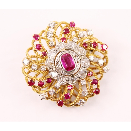 105 - A pair of ruby and diamond lapel brooches, the central cushion cut rubies within a surround of old c... 