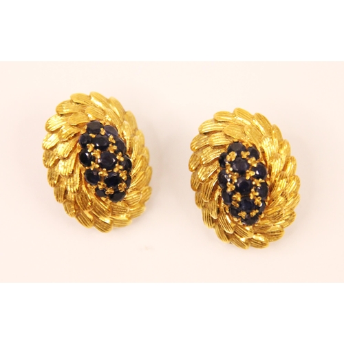 109 - A pair of sapphire and yellow metal earrings, the central thirteen round cut sapphires in a raised o... 