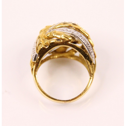 111 - A diamond and two tone bombe cocktail ring, the yellow and white metal striped design ring with plan... 