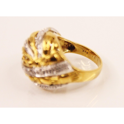 111 - A diamond and two tone bombe cocktail ring, the yellow and white metal striped design ring with plan... 