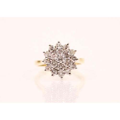 149 - A 20th century diamond cluster ring, the head of the ring designed as a flower with central round cu... 