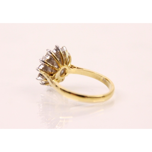 149 - A 20th century diamond cluster ring, the head of the ring designed as a flower with central round cu... 