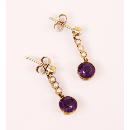 153 - A pair of amethyst and seed pearl earrings, the seed pearl set stud suspending three seed pearls and... 