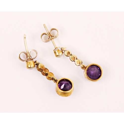 153 - A pair of amethyst and seed pearl earrings, the seed pearl set stud suspending three seed pearls and... 