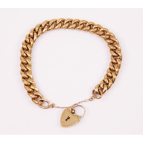 157 - A yellow metal hollow link bracelet, the curb link bracelet with engraved floral decoration to each ... 