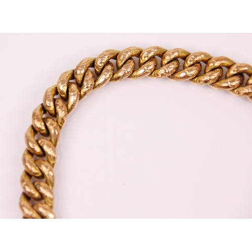 157 - A yellow metal hollow link bracelet, the curb link bracelet with engraved floral decoration to each ... 