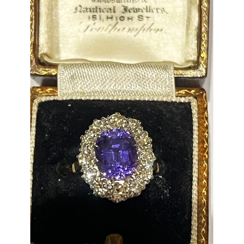 160 - A mid 20th century certified colour change sapphire cluster, the oval cut sapphire (stated as 4.62 c... 