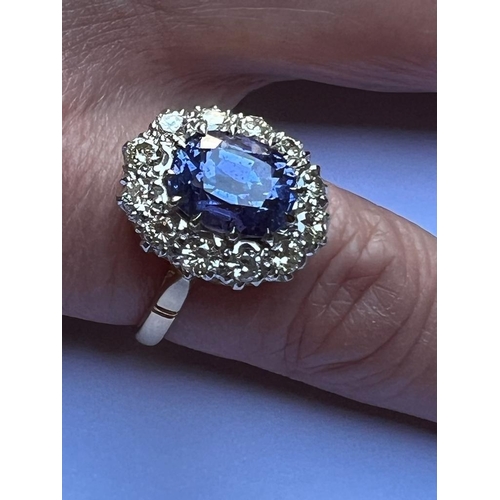 160 - A mid 20th century certified colour change sapphire cluster, the oval cut sapphire (stated as 4.62 c... 